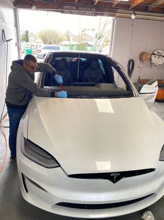 Rear windshield install — heated defroster glass on sedan